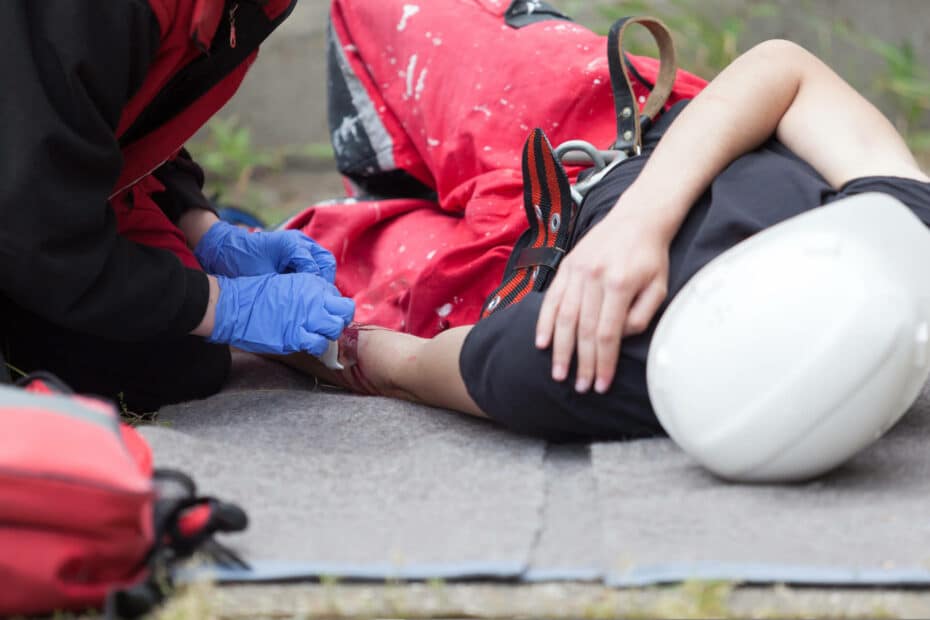 holding injured shoulder